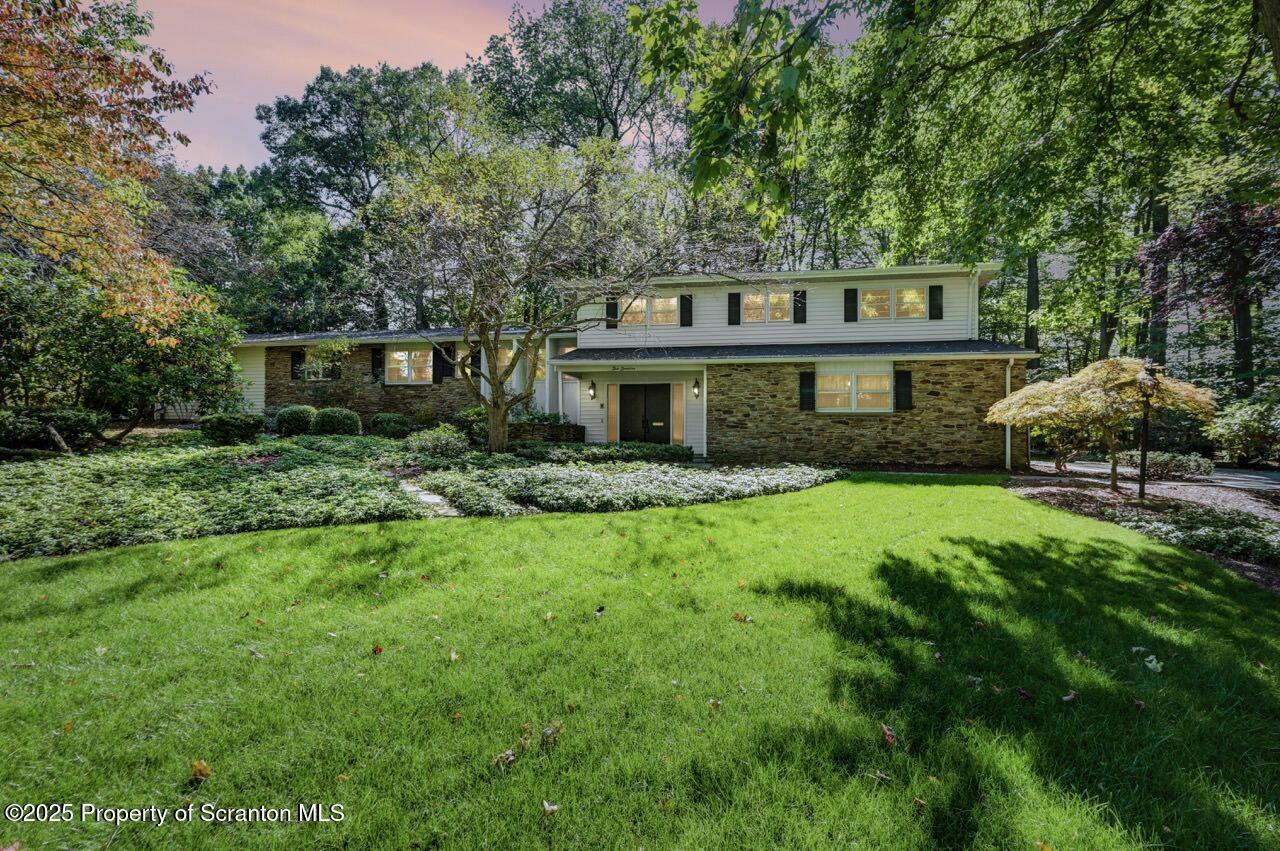 517 Grandview Street Clarks Summit, PA 18411 - Photo 1 of 86 a front view of a house with a garden