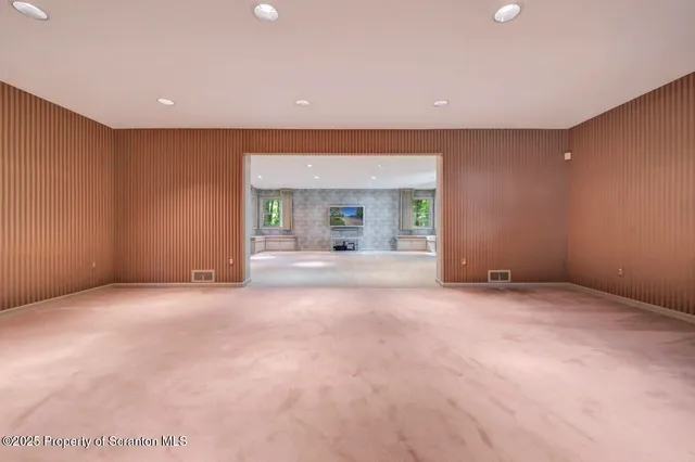 a kitchen with granite countertop cabinets stainless steel appliances and a counter space