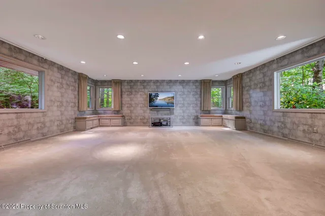 a kitchen with a refrigerator stove and white cabinets