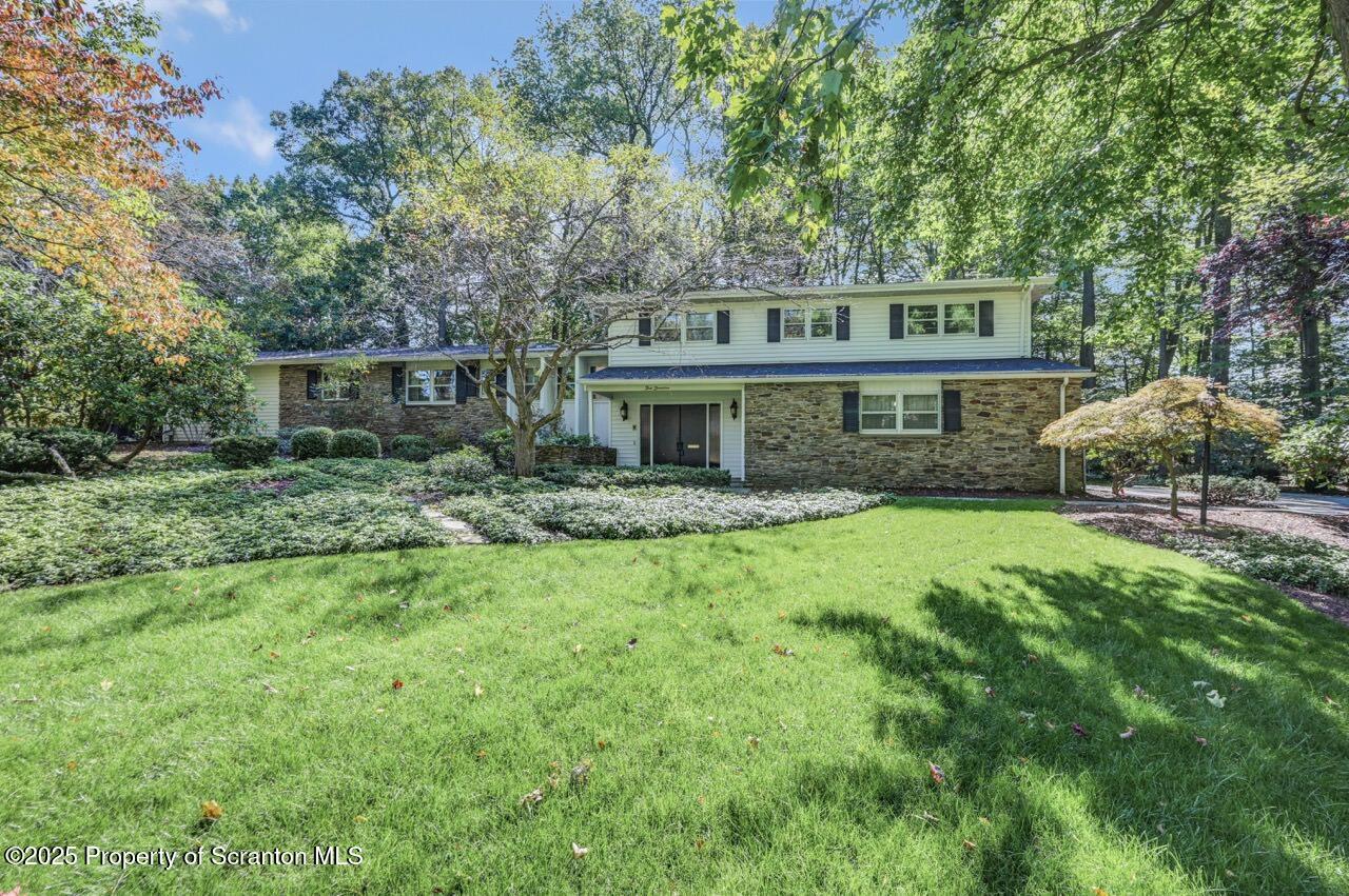 517 Grandview Street Clarks Summit, PA 18411 - Photo 2 of 86 a front view of a house with a garden
