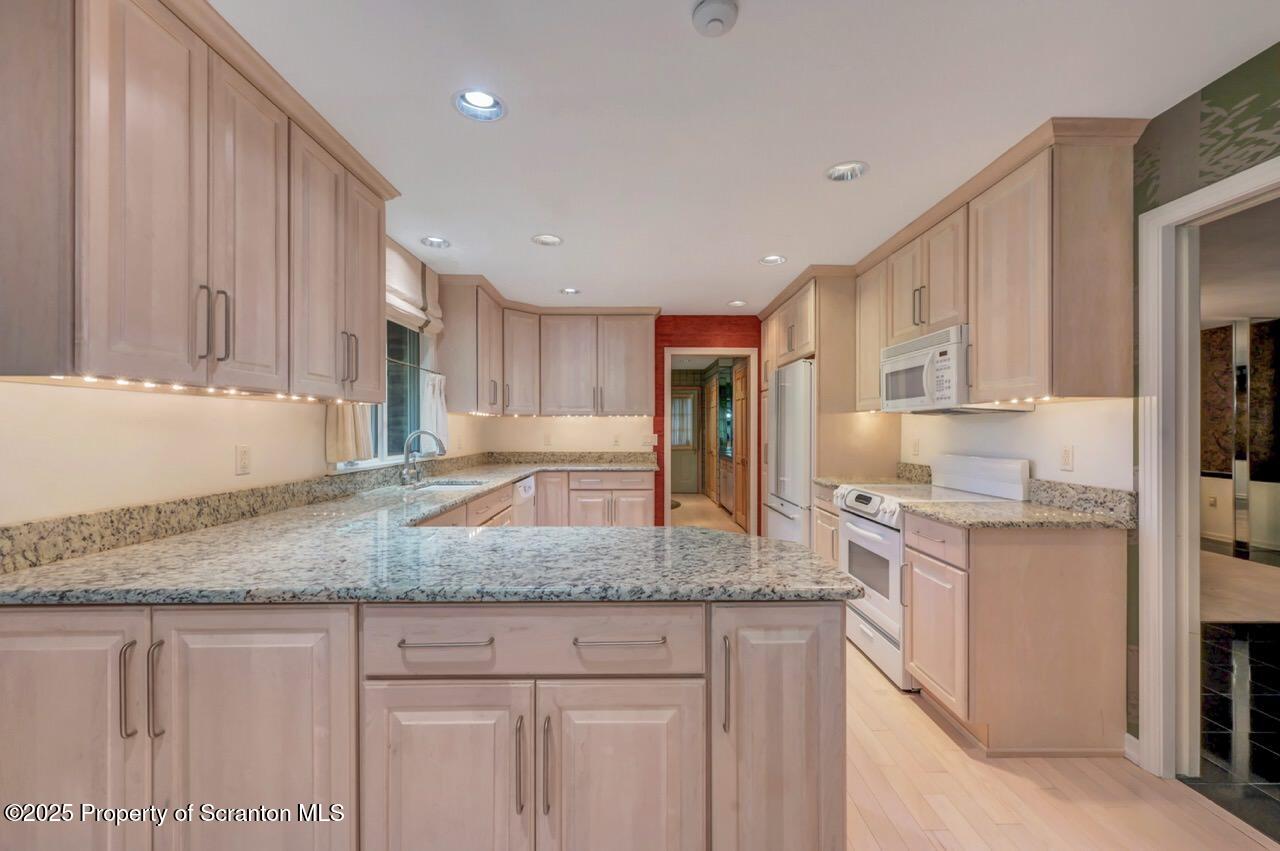 517 Grandview Street Clarks Summit, PA 18411 - Photo 24 of 86 a kitchen with granite countertop cabinets stainless steel appliances and a counter space