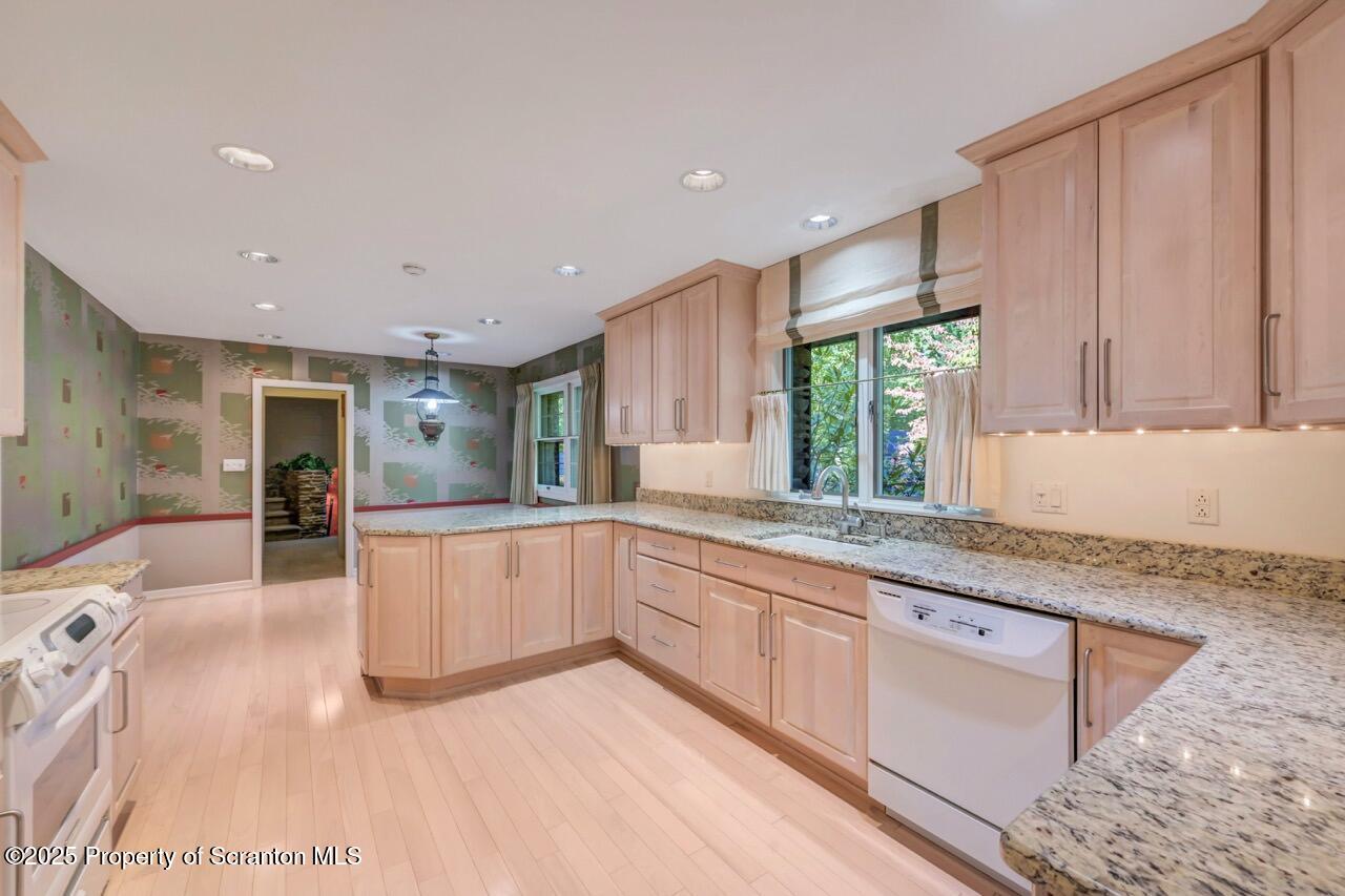 517 Grandview Street Clarks Summit, PA 18411 - Photo 27 of 86 a large kitchen with kitchen island granite countertop a sink window and cabinets