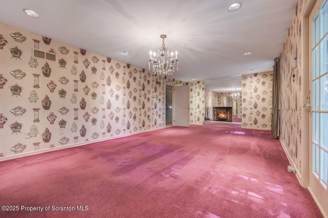 517 Grandview Street Clarks Summit, PA 18411 - Photo 35 of 86 a view of empty room with chandelier and front door