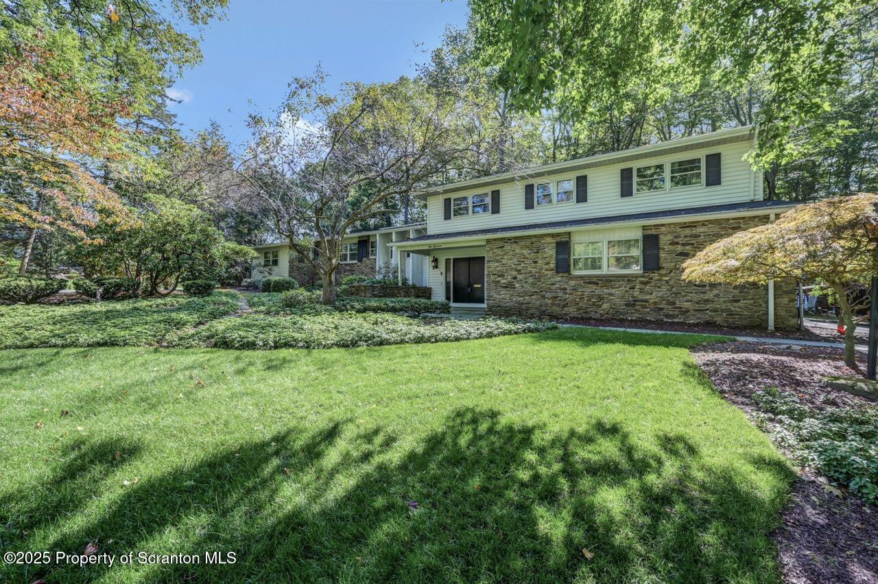 517 Grandview Street Clarks Summit, PA 18411 - Photo 4 of 86 a front view of a house with a garden