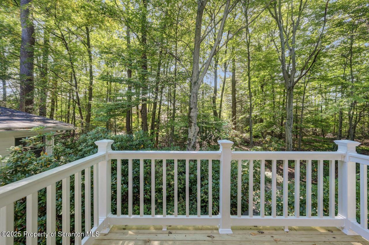 517 Grandview Street Clarks Summit, PA 18411 - Photo 41 of 86 a view of a wooden deck and trees