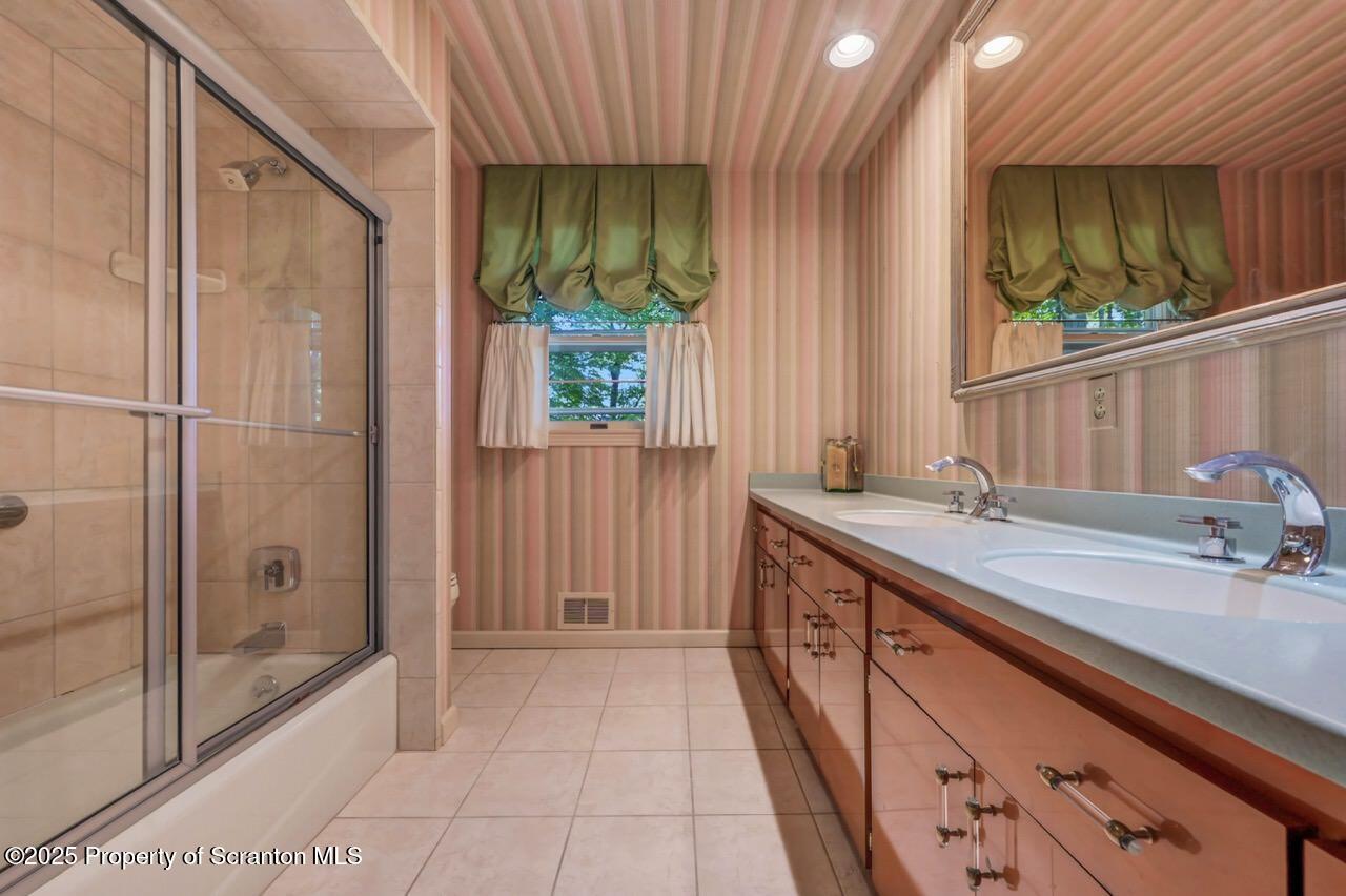 517 Grandview Street Clarks Summit, PA 18411 - Photo 47 of 86 a bathroom with a granite countertop sink and a mirror