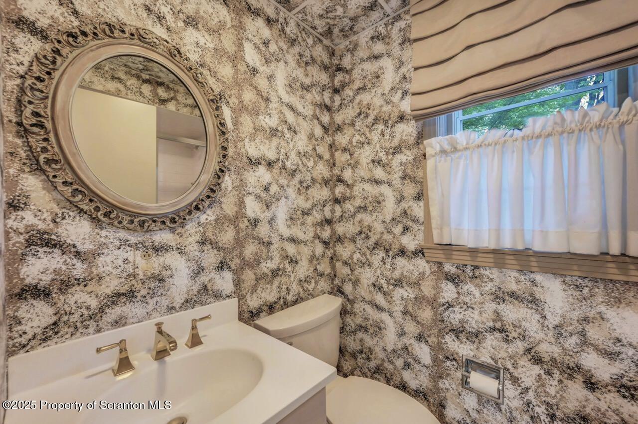 517 Grandview Street Clarks Summit, PA 18411 - Photo 57 of 86 a bathroom with a sink and a mirror