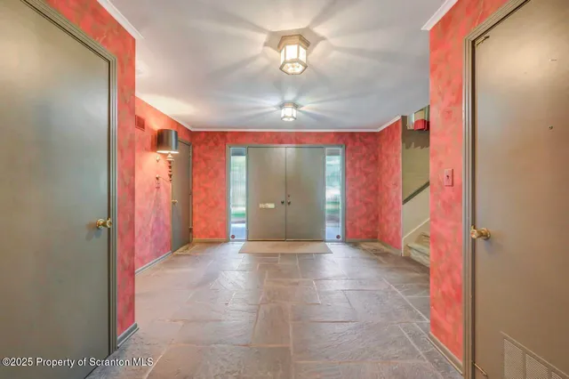a view of livingroom with an empty space and a garage