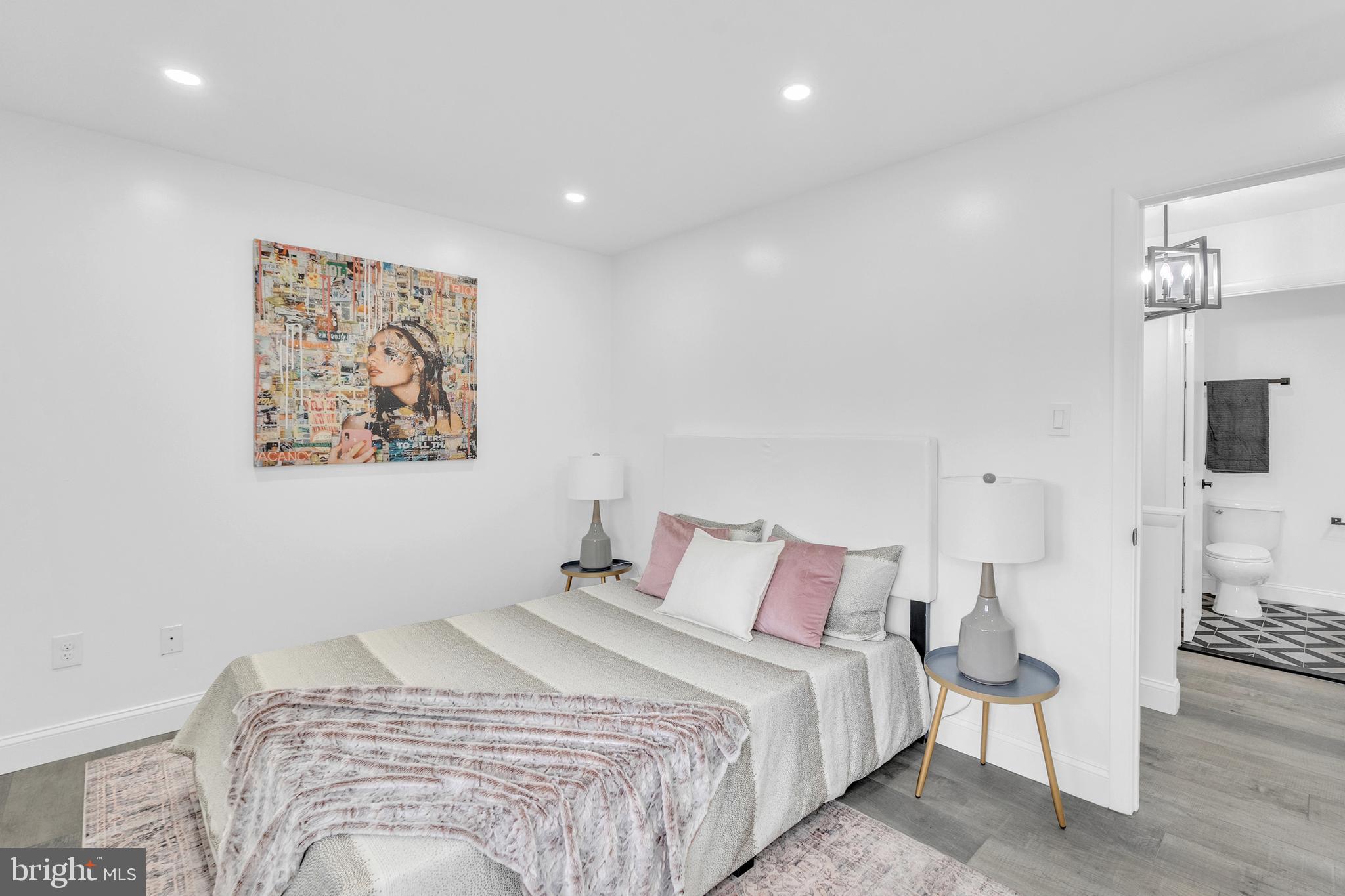 201 Timber Creek Road Clementon, NJ 08021 - Photo 28 of 62 a bedroom with a large bed and a lamp