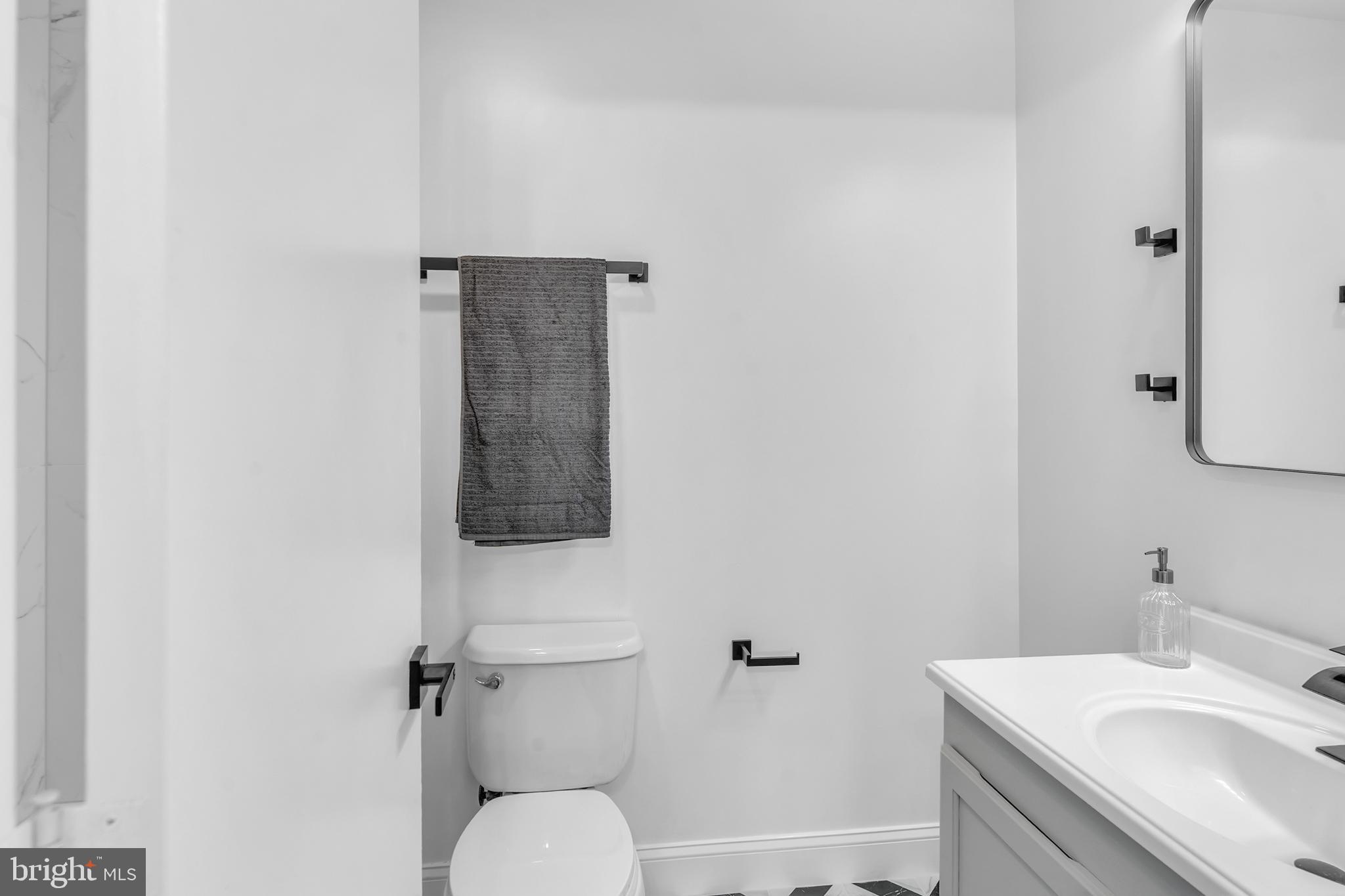 201 Timber Creek Road Clementon, NJ 08021 - Photo 32 of 62 a bathroom with a sink toilet and vanity