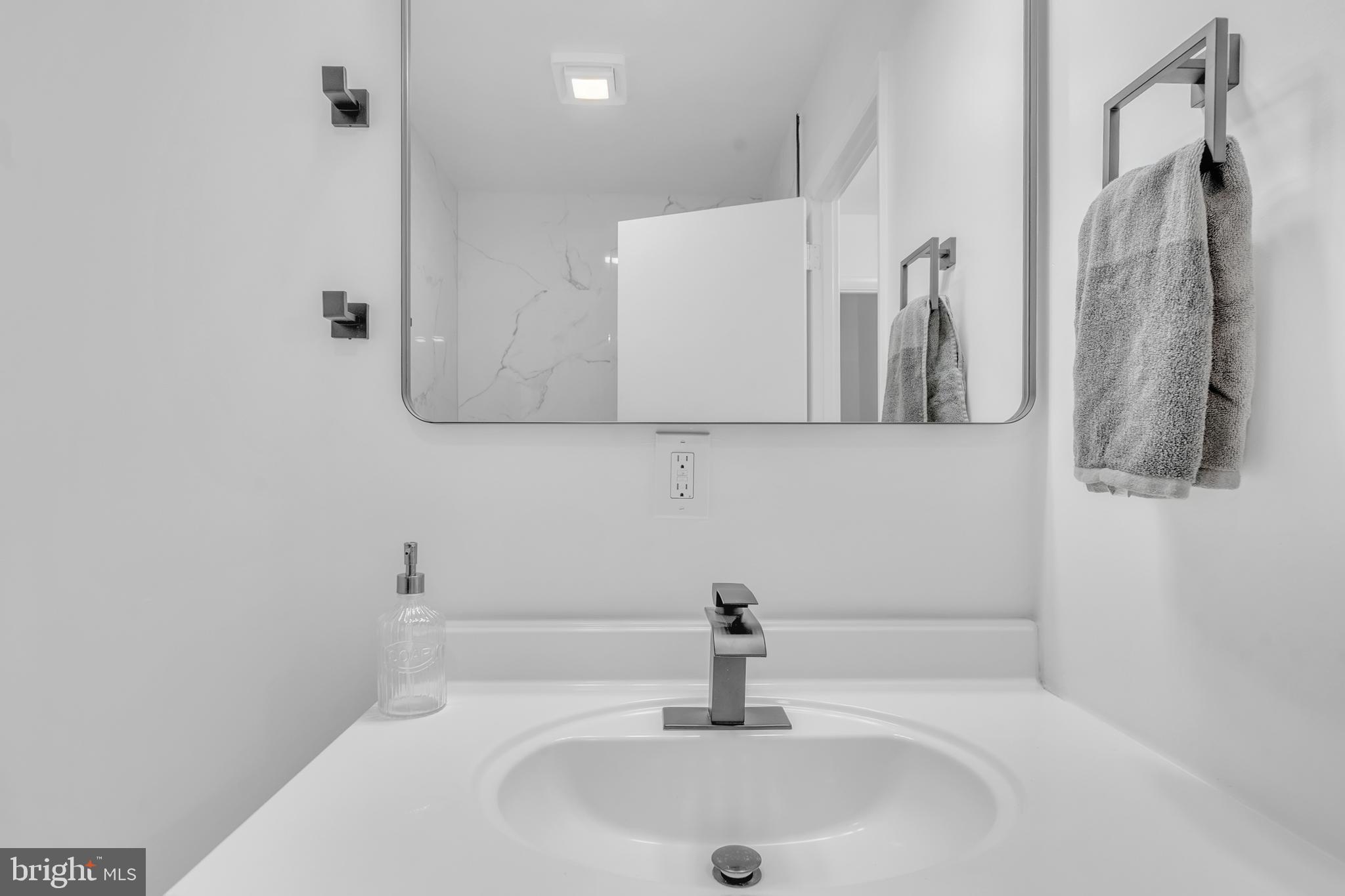 201 Timber Creek Road Clementon, NJ 08021 - Photo 34 of 62 a bathroom with a sink and mirror