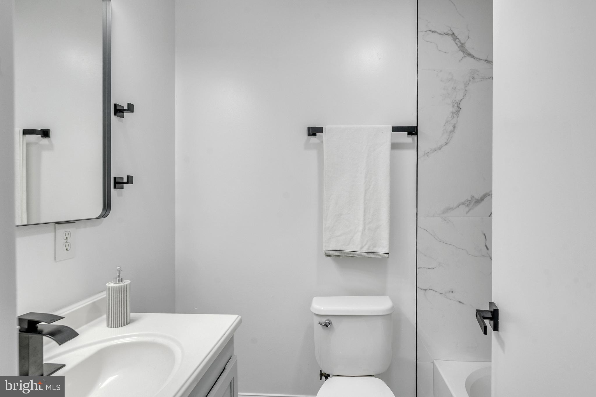 201 Timber Creek Road Clementon, NJ 08021 - Photo 46 of 62 a bathroom with a sink toilet and vanity