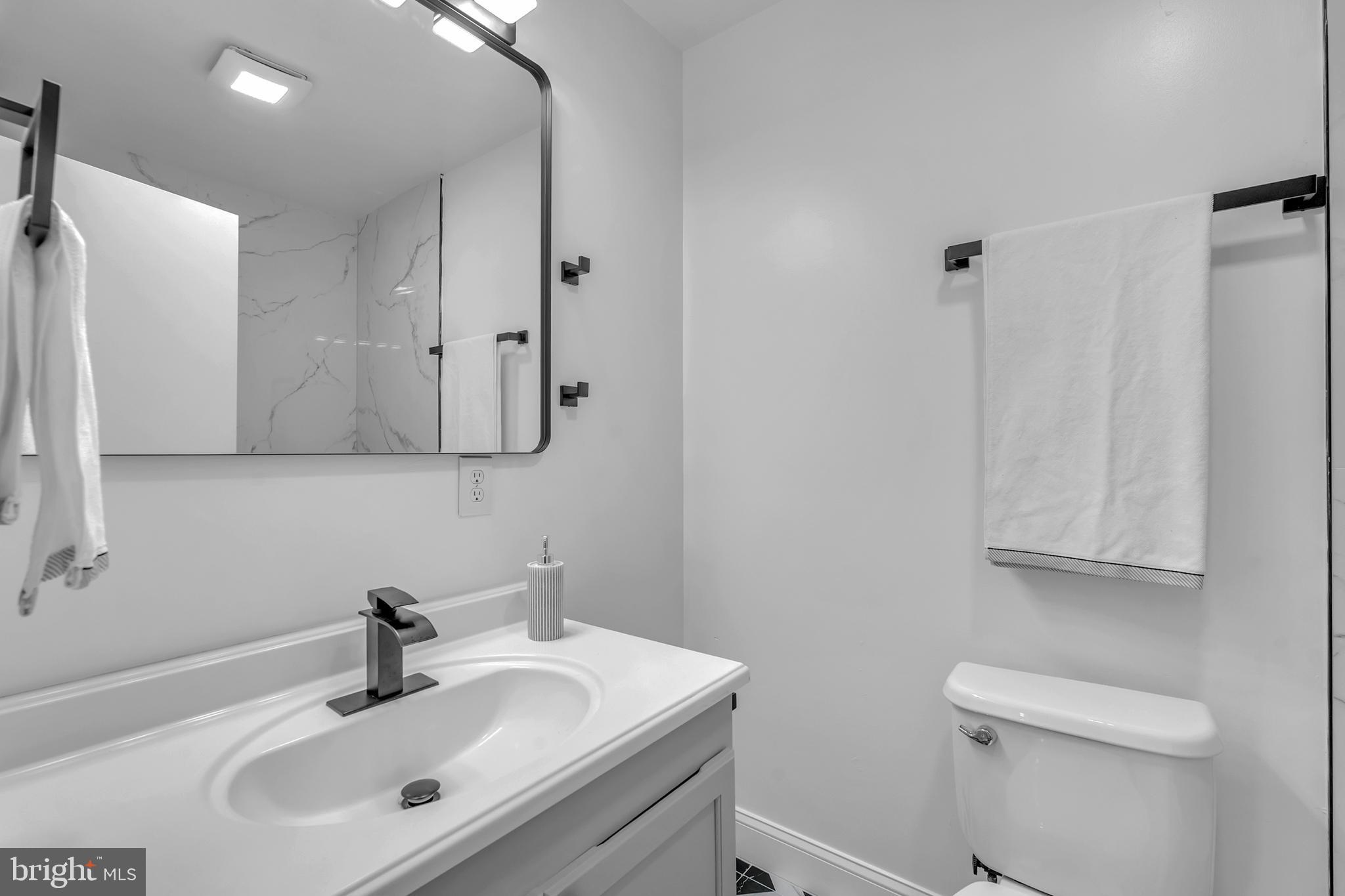 201 Timber Creek Road Clementon, NJ 08021 - Photo 48 of 62 a bathroom with a sink toilet and mirror