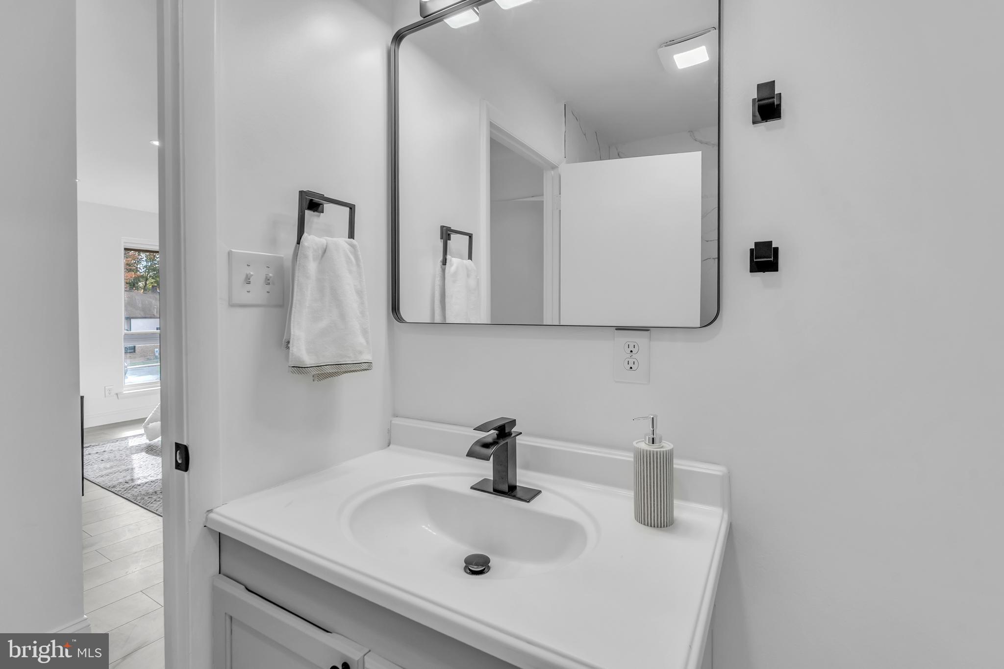 201 Timber Creek Road Clementon, NJ 08021 - Photo 49 of 62 a bathroom with a sink and a mirror