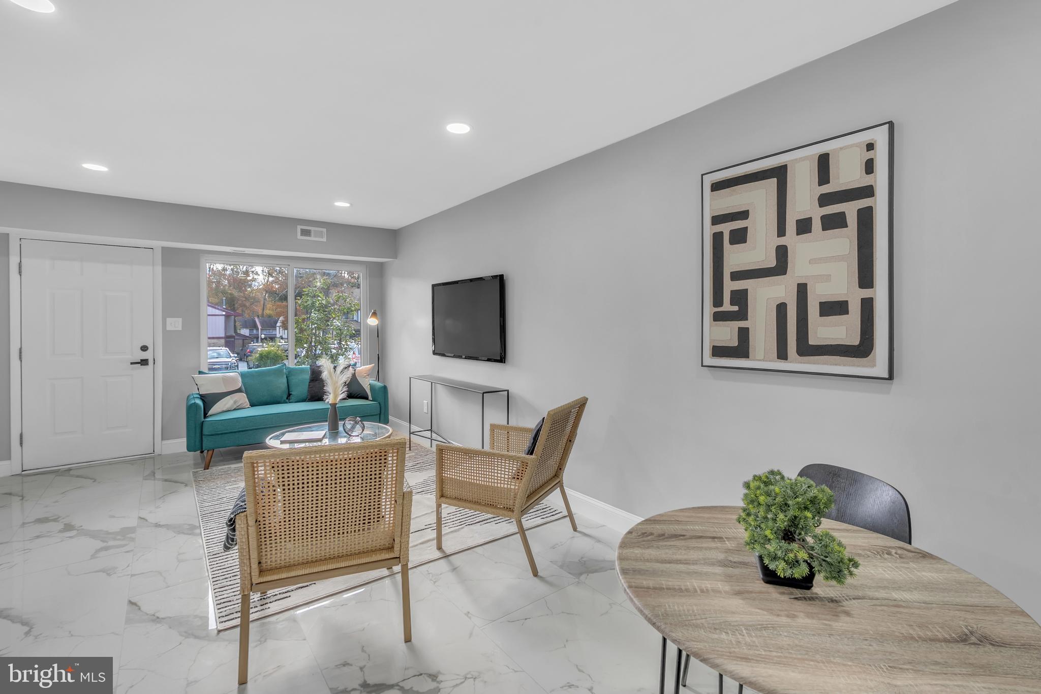 201 Timber Creek Road Clementon, NJ 08021 - Photo 6 of 62 a living room with furniture and a flat screen tv