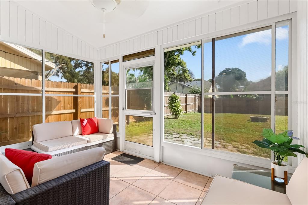 4537 South Lockwood Ridge Road Sarasota, FL 34231 - Photo 20 of 22 a living room with large windows