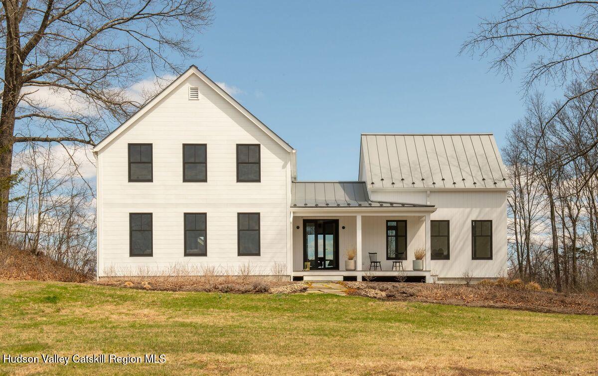 a front view of a house with swimming pool