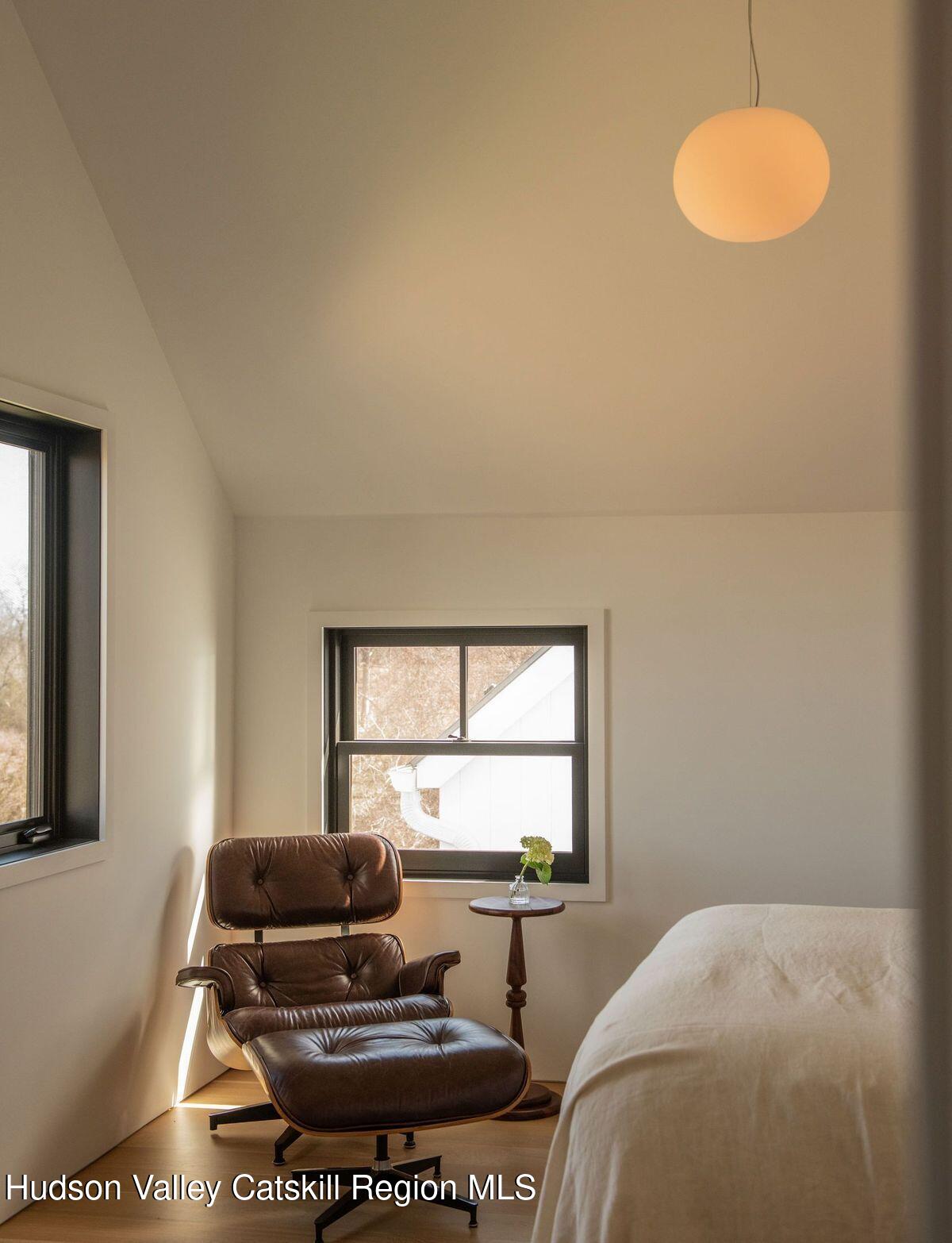 251 Viewmont Road Germantown, NY 12526 - Photo 16 of 22 a living room with a bed furniture and a window