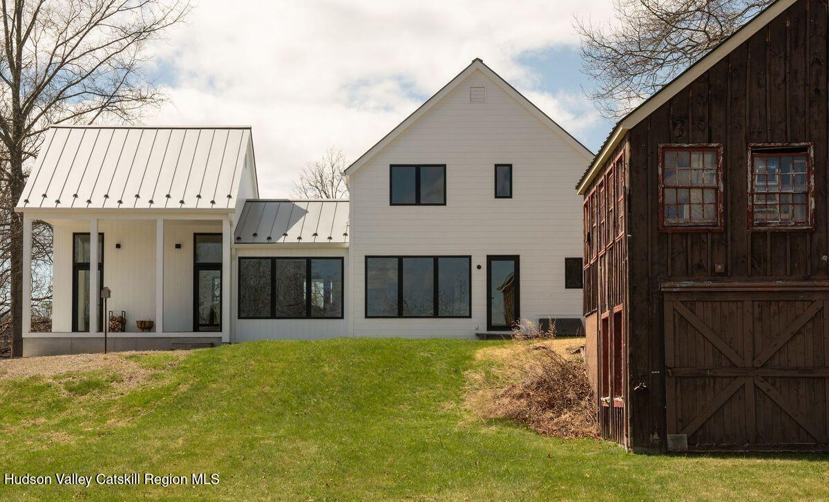 251 Viewmont Road Germantown, NY 12526 - Photo 2 of 22 a front view of a house with garden