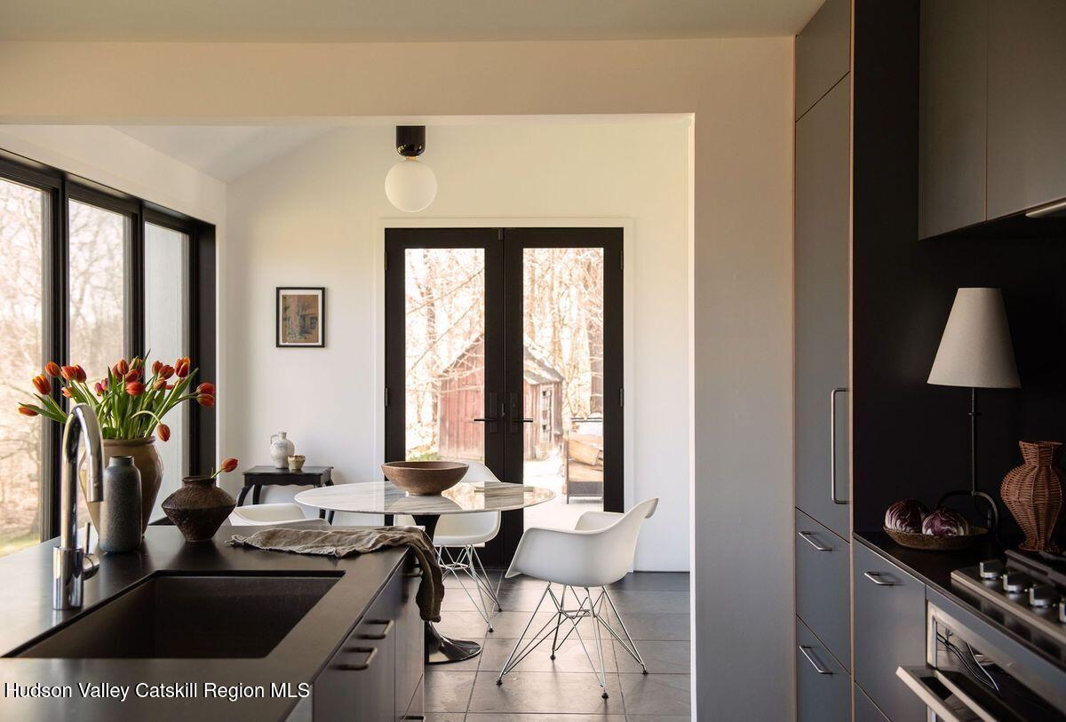 251 Viewmont Road Germantown, NY 12526 - Photo 5 of 22 a table room with a couch and a potted plant