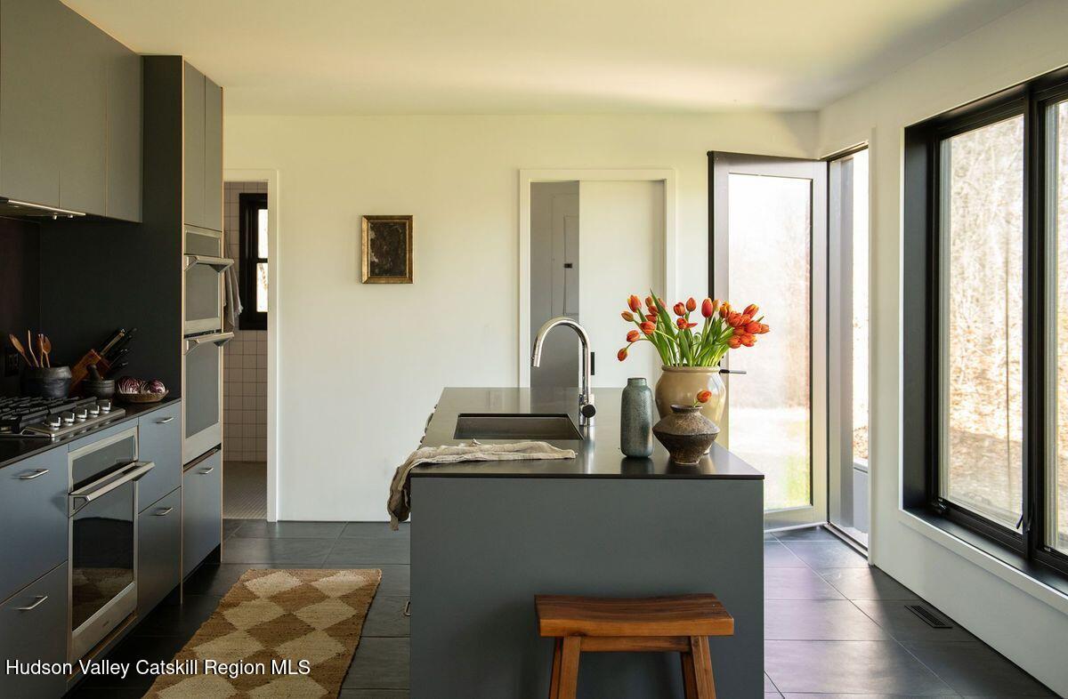 251 Viewmont Road Germantown, NY 12526 - Photo 6 of 22 a kitchen with a refrigerator and a stove top oven