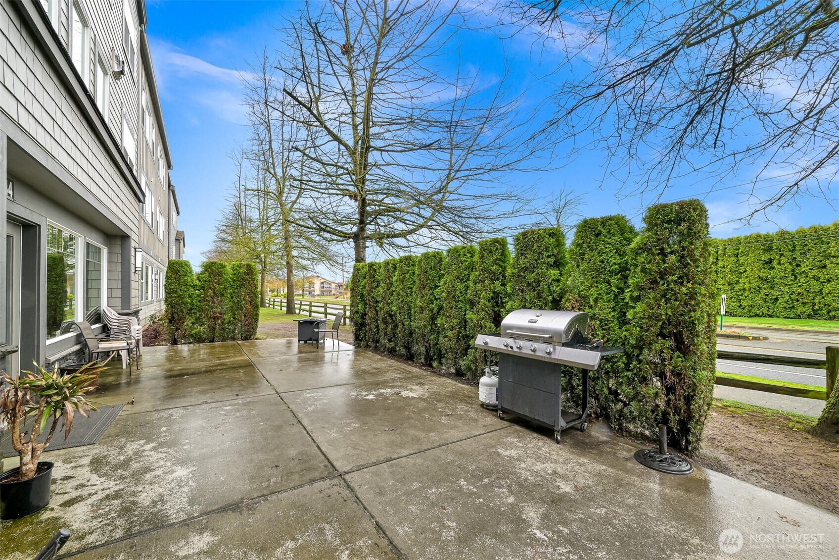 8844 Depot Road, Unit B101 Lynden, WA 98264 - Photo 26 of 30 a view of a patio with table and chairs and potted plants