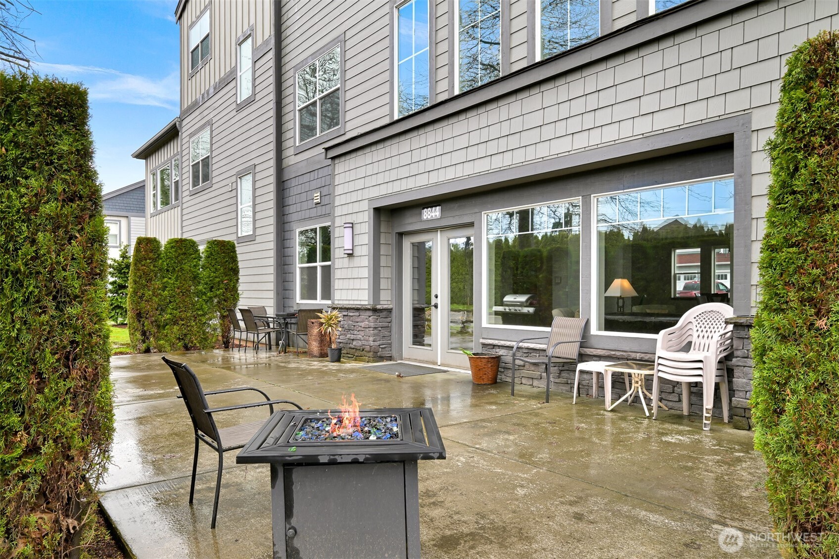 8844 Depot Road, Unit B101 Lynden, WA 98264 - Photo 28 of 30 a view of a patio with table and chairs and potted plants
