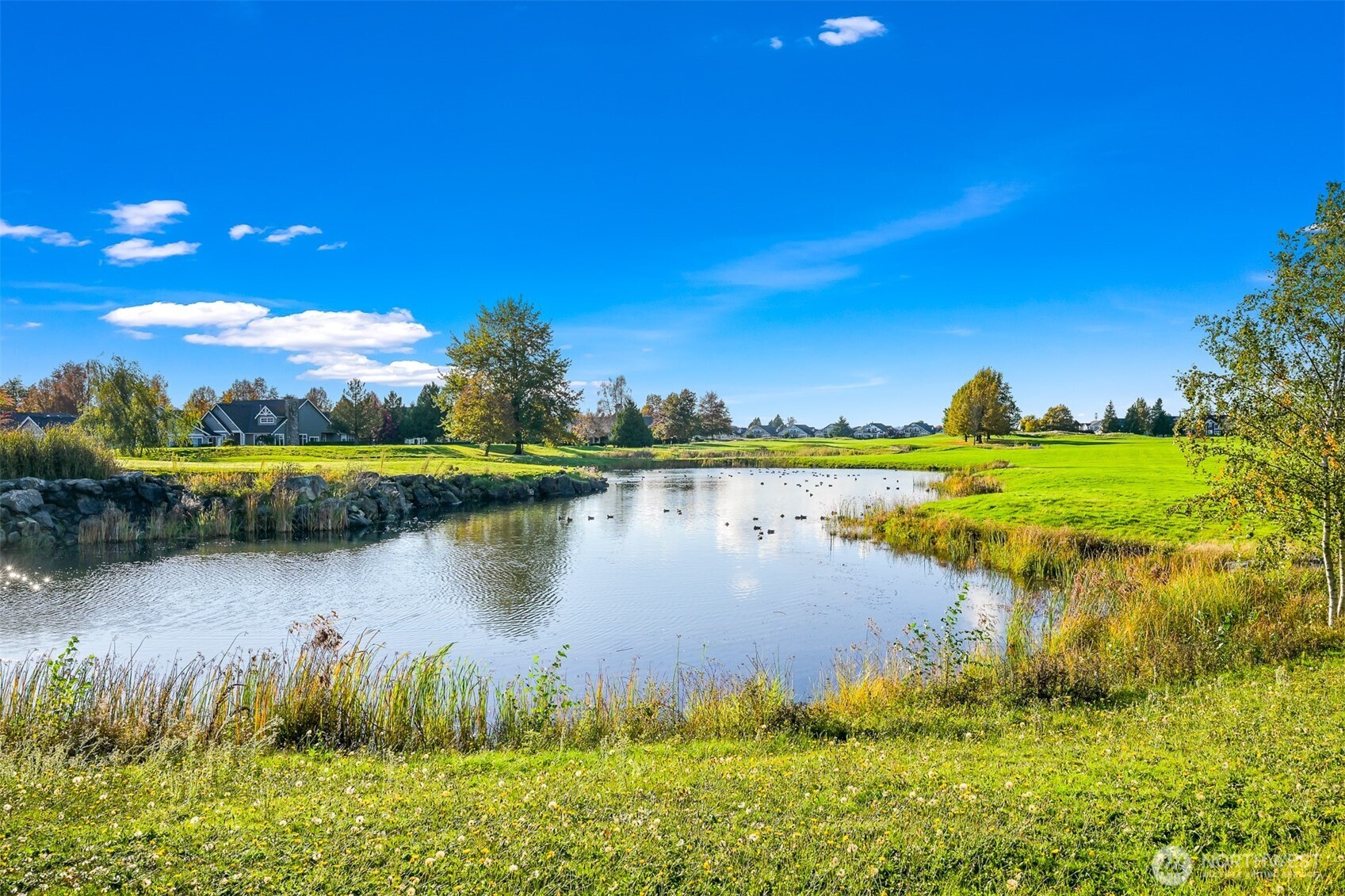 8844 Depot Road, Unit B101 Lynden, WA 98264 - Photo 30 of 30 a view of a lake with a house in the background