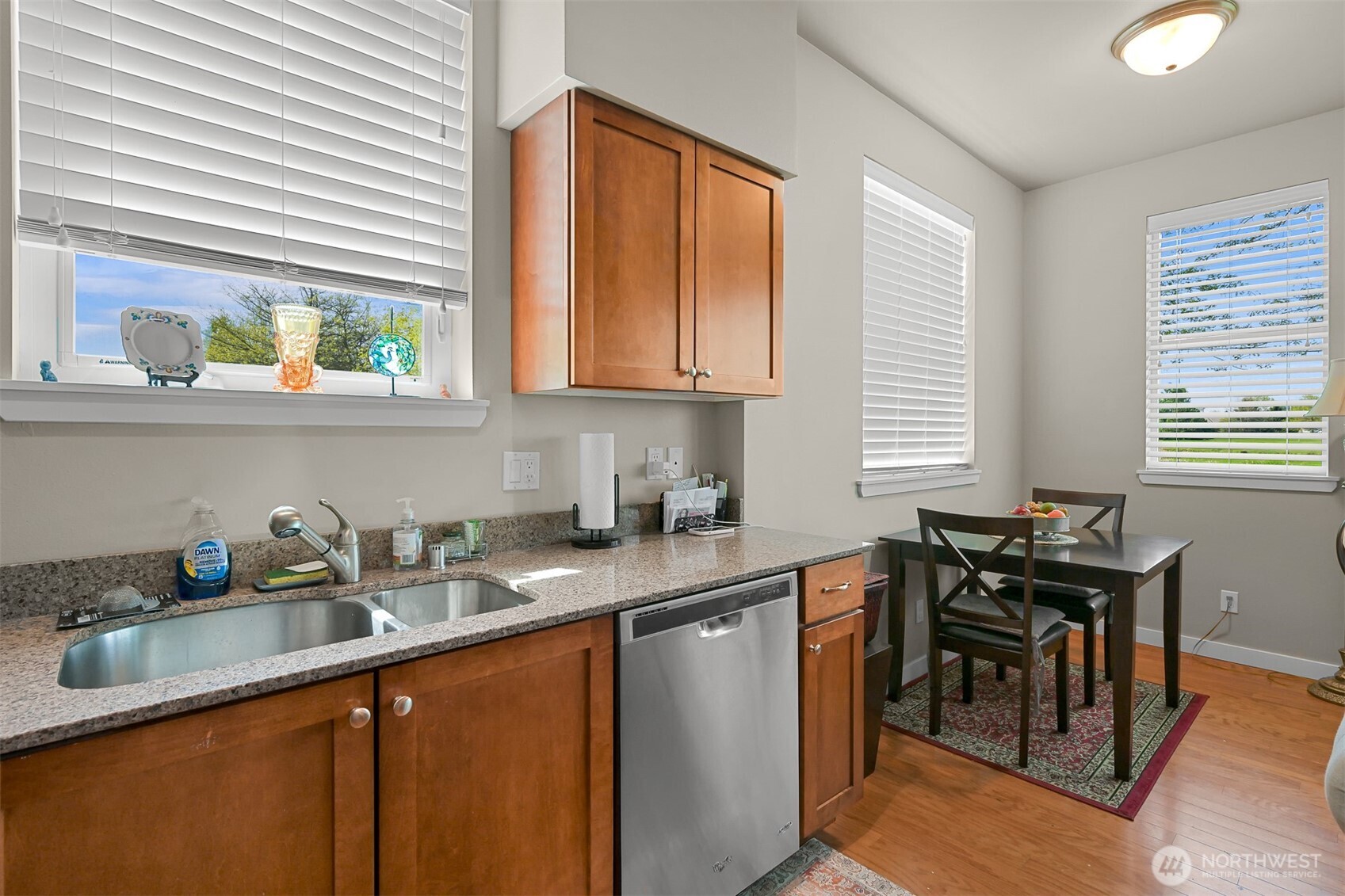 8844 Depot Road, Unit B101 Lynden, WA 98264 - Photo 7 of 30 a kitchen with stainless steel appliances granite countertop sink stove top oven and cabinets