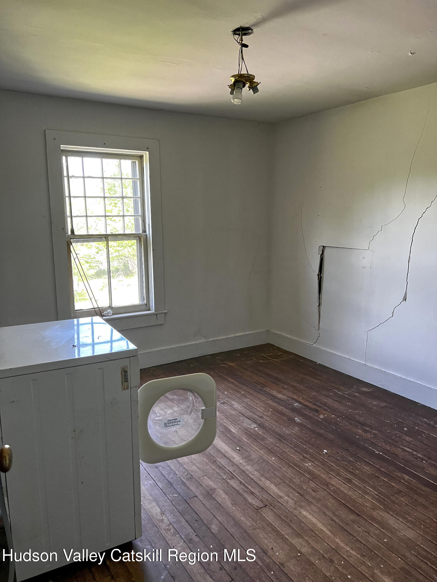 217 Platte Clove Road Elka Park, NY 12427 - Photo 10 of 18 wooden floor in an empty room with a window