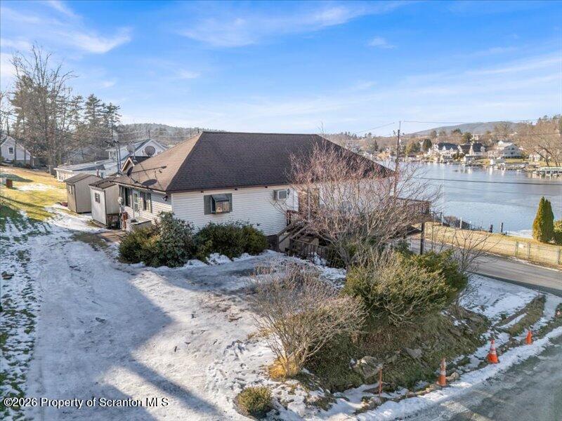 1228 Lake Road Factoryville, PA 18419 - Photo 35 of 43 a aerial view of a house with a yard and lake view
