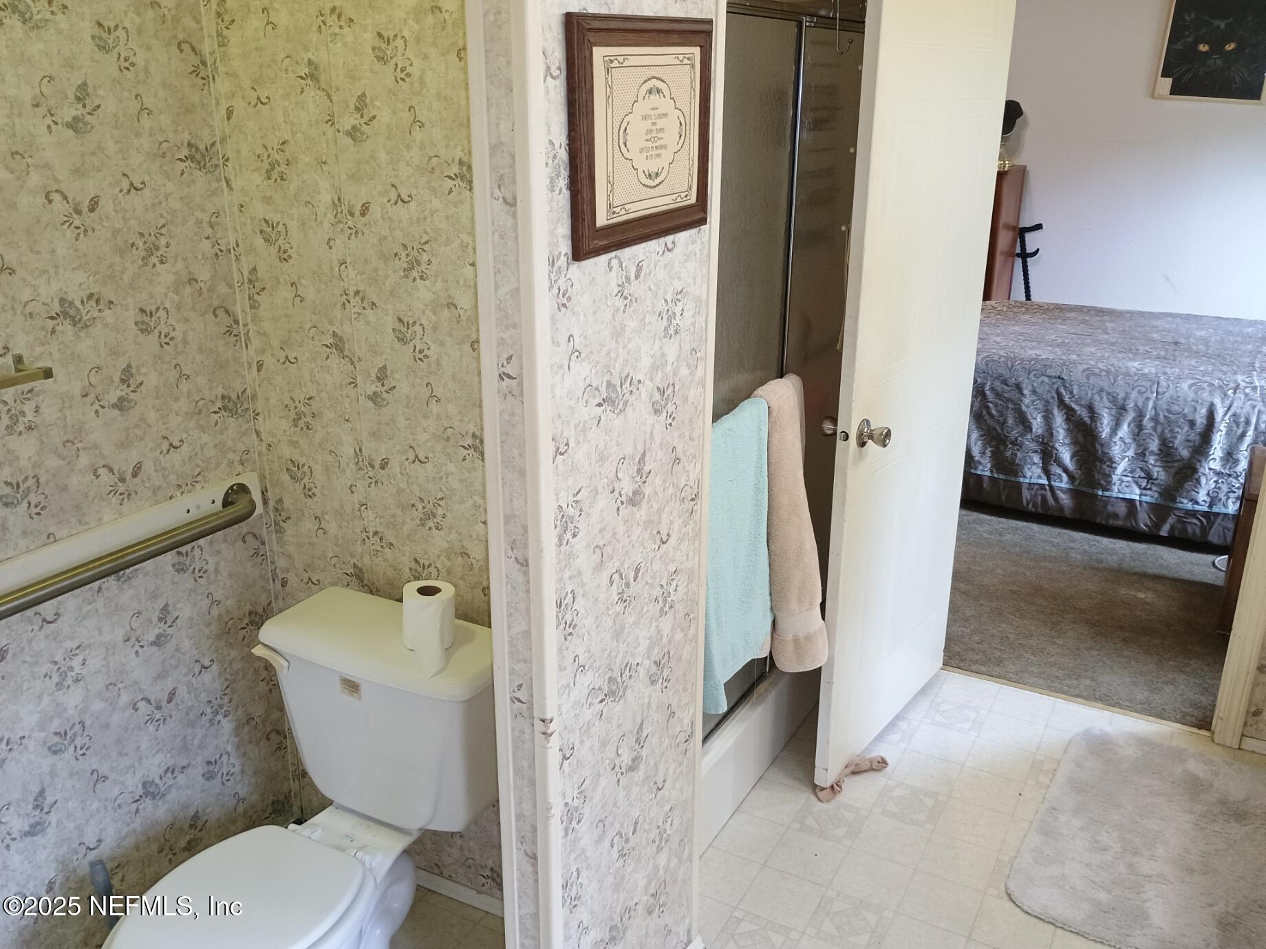 136 Boots Road Melrose, FL 32666 - Photo 25 of 40 a bathroom with a toilet and a shower