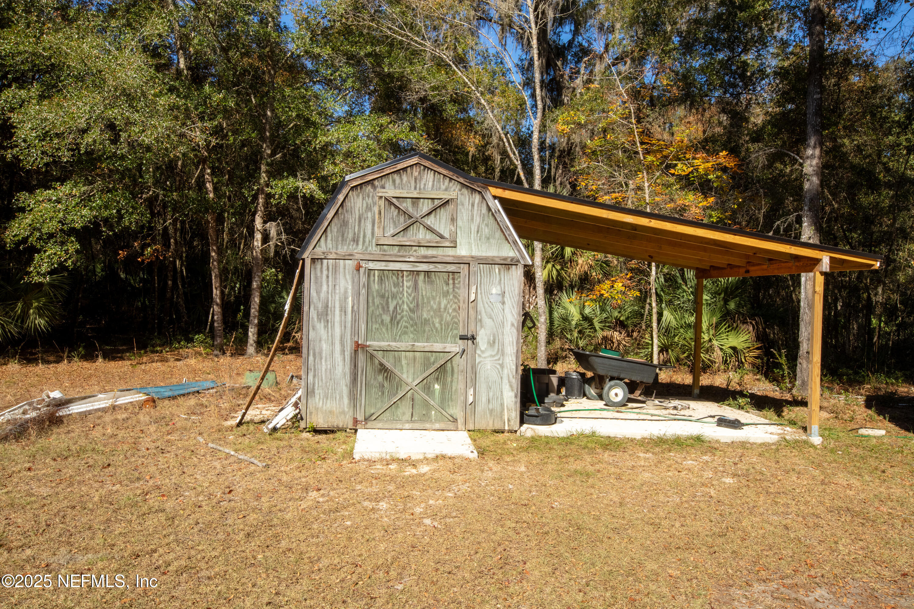 136 Boots Road Melrose, FL 32666 - Photo 29 of 40 a view of a house with snow on the wall