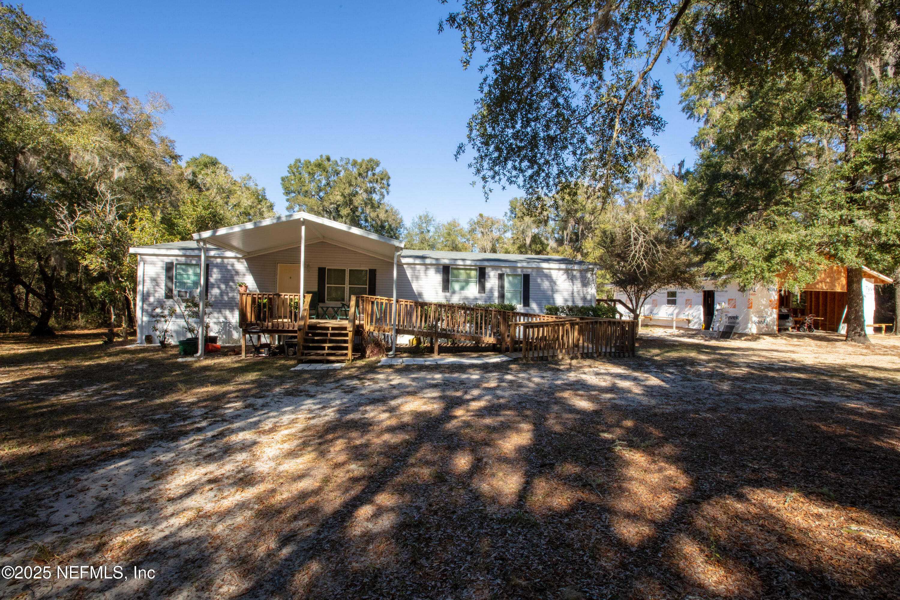 136 Boots Road Melrose, FL 32666 - Photo 3 of 40 a view of a town with large trees