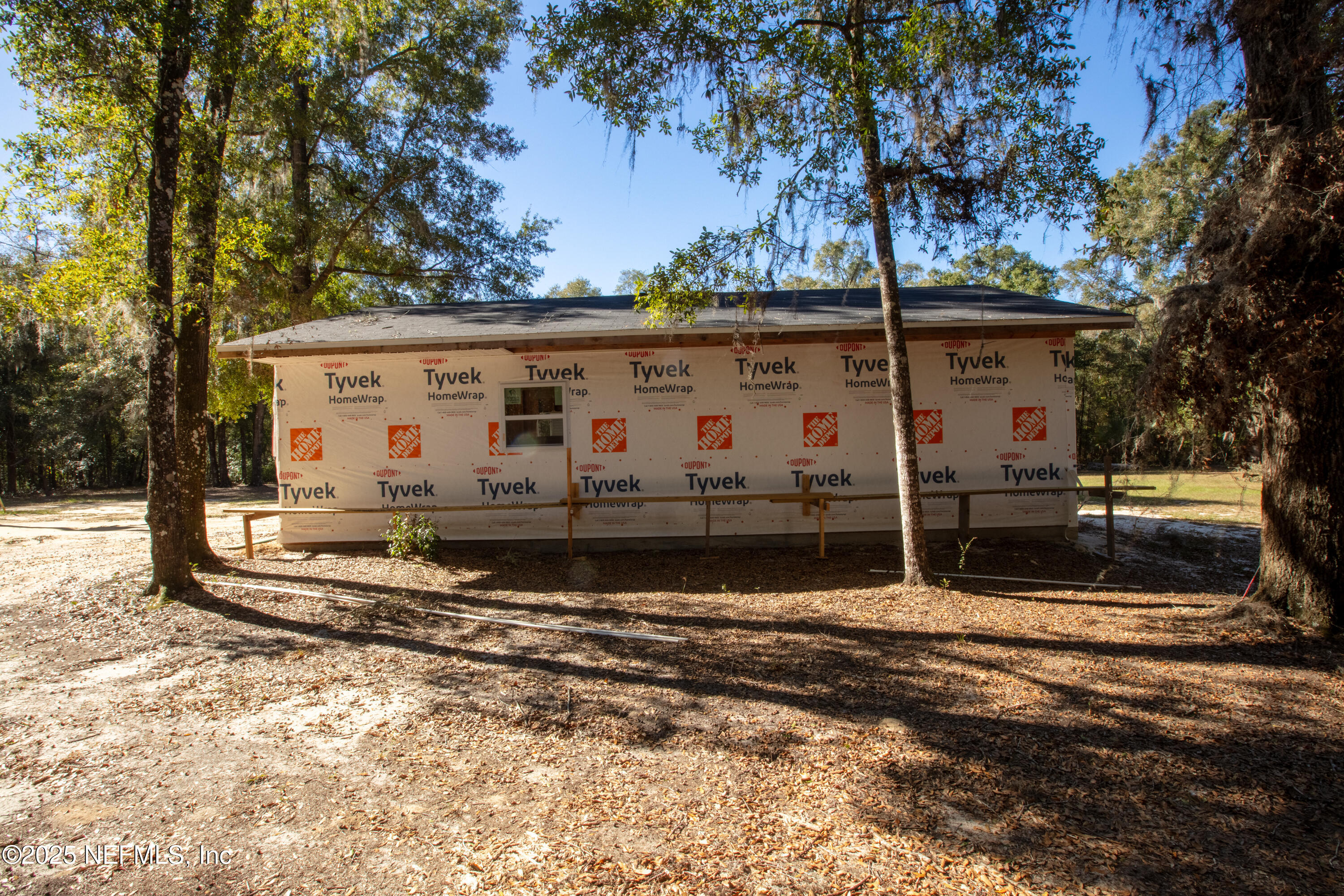 136 Boots Road Melrose, FL 32666 - Photo 32 of 40 a view of a house with a yard