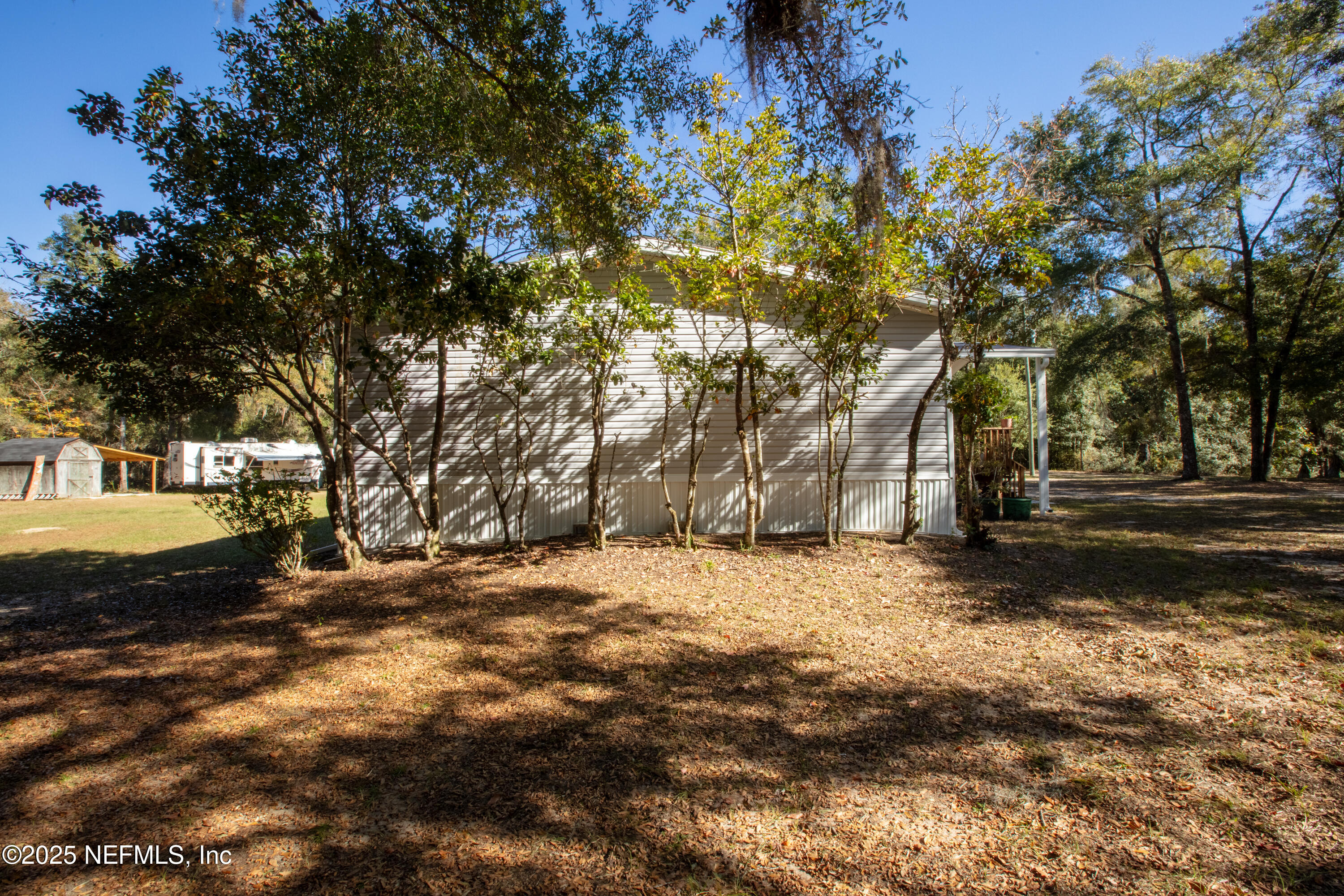 136 Boots Road Melrose, FL 32666 - Photo 5 of 40 a view of road with large trees