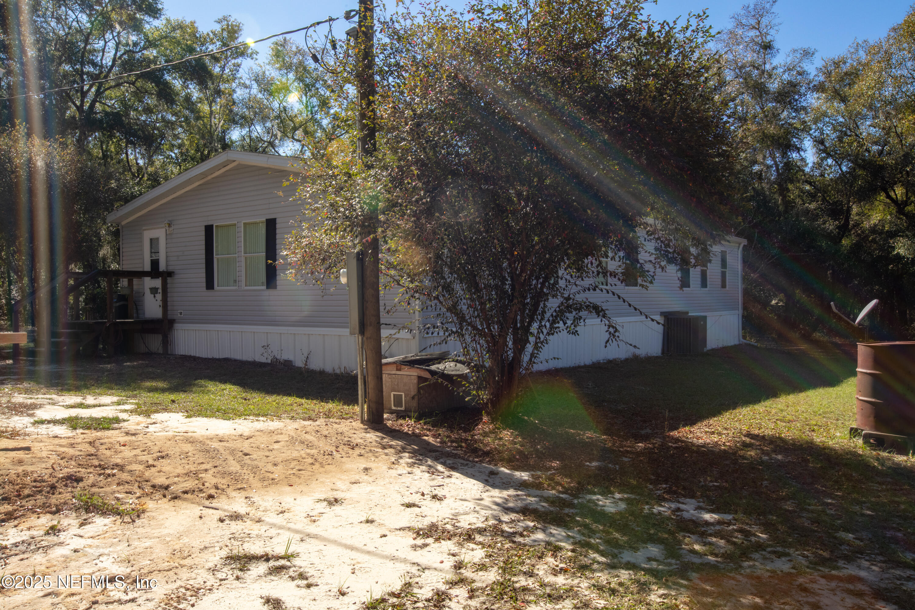 136 Boots Road Melrose, FL 32666 - Photo 8 of 40 a view of a house with a yard covered in snow
