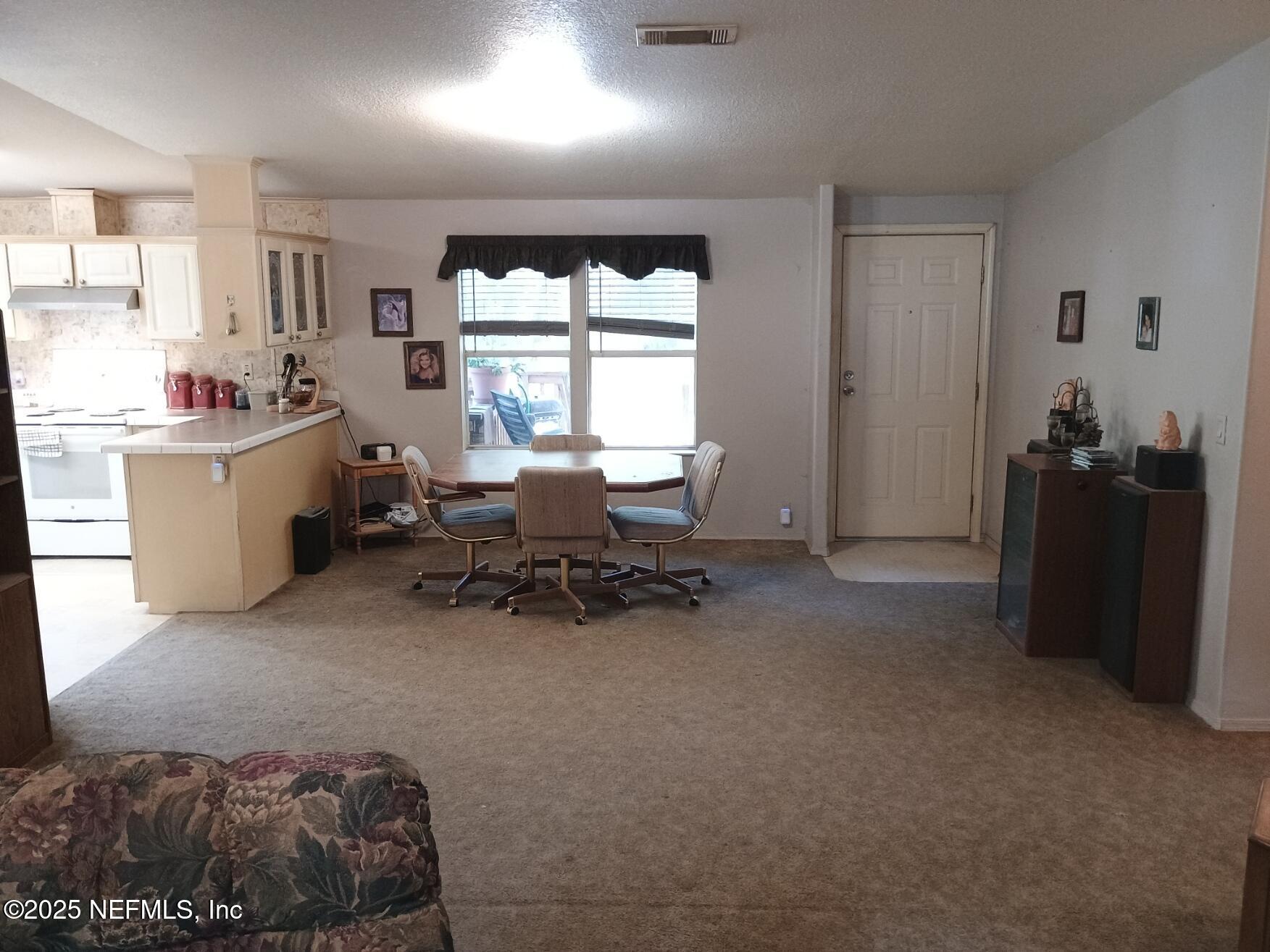 136 Boots Road Melrose, FL 32666 - Photo 10 of 40 a bed room with furniture and a window