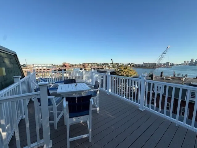 a view of roof deck with patio