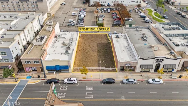 an aerial view of a building with parking