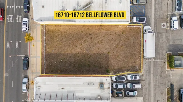 an aerial view of a residential apartment building with a large tree