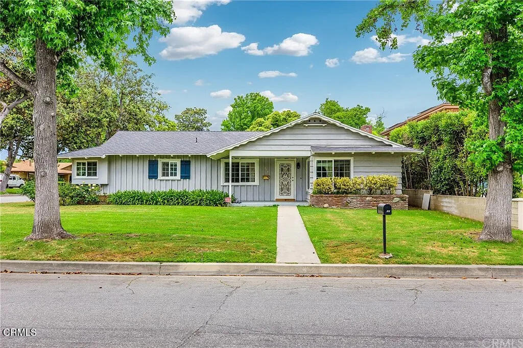 303 East Las Flores Avenue Arcadia, CA 91006 - Photo 1 of 37 a front view of a house with a garden