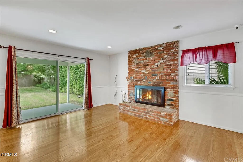 303 East Las Flores Avenue Arcadia, CA 91006 - Photo 11 of 37 a view of an empty room with a fireplace and a window
