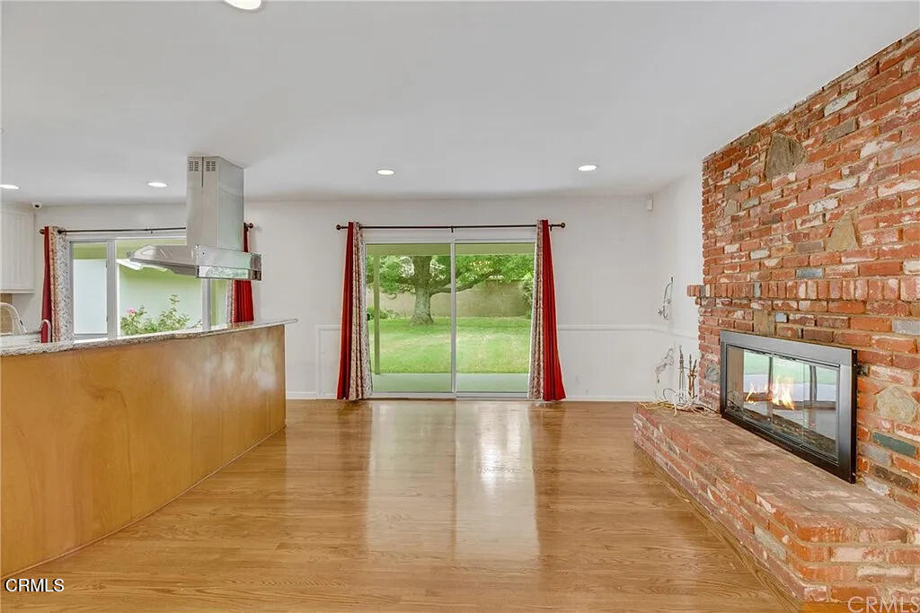 303 East Las Flores Avenue Arcadia, CA 91006 - Photo 12 of 37 a view of an empty room with a fireplace and a window