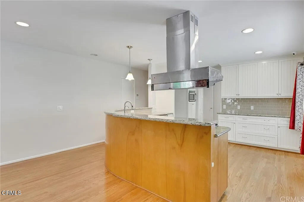 303 East Las Flores Avenue Arcadia, CA 91006 - Photo 14 of 37 a kitchen with stainless steel appliances granite countertop a sink a stove and a refrigerator