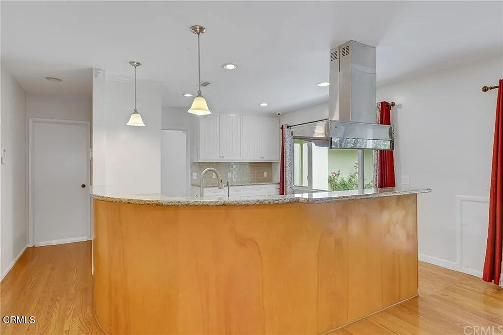 303 East Las Flores Avenue Arcadia, CA 91006 - Photo 15 of 37 a view of a kitchen with a oven and wooden floor