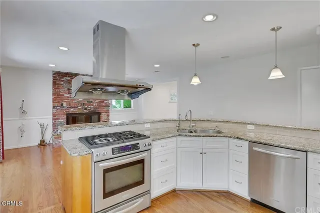 a kitchen with a stove and a sink