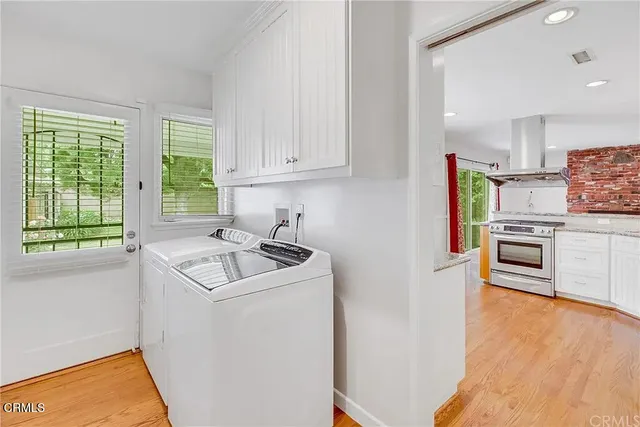 a kitchen with appliances cabinets and a sink