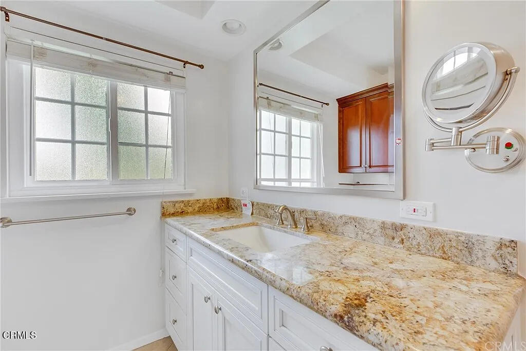 303 East Las Flores Avenue Arcadia, CA 91006 - Photo 26 of 37 a bathroom with a granite countertop sink and mirror with bathtub