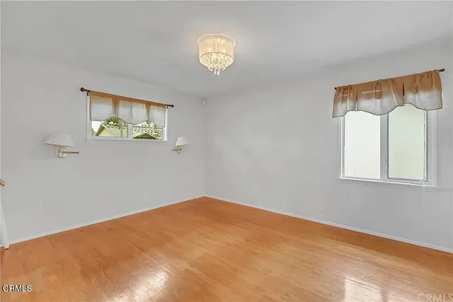 a view of empty room with windows